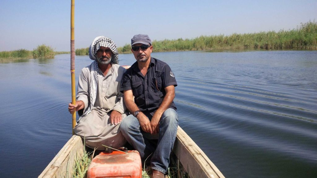 The journalist with an Iraqi man from Al-Chibayish, Nassiriya province