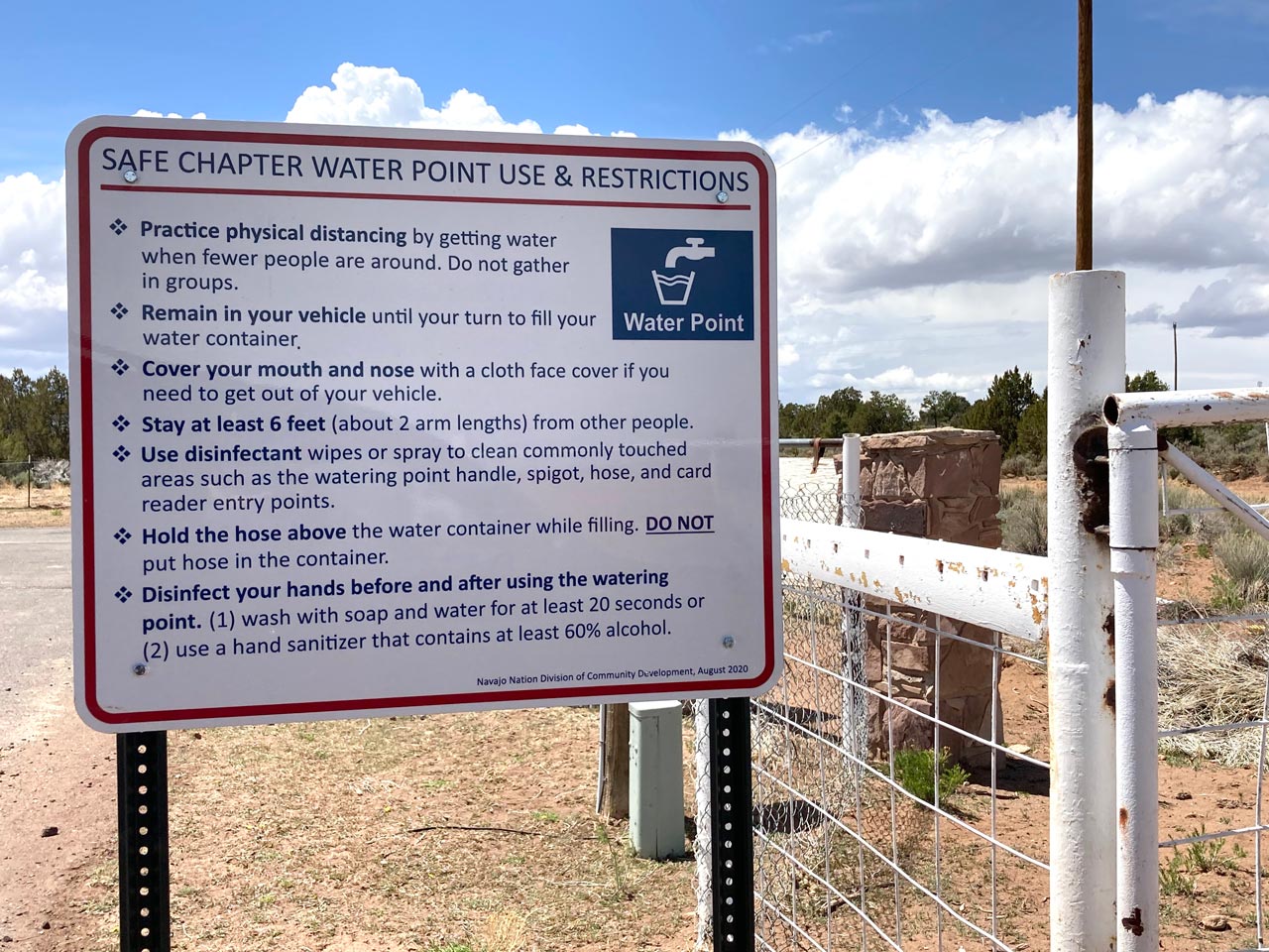A sign outside the Chi Chil Tah Chapter House explains how to safely fill water containers during the COVID-19 pandemic.