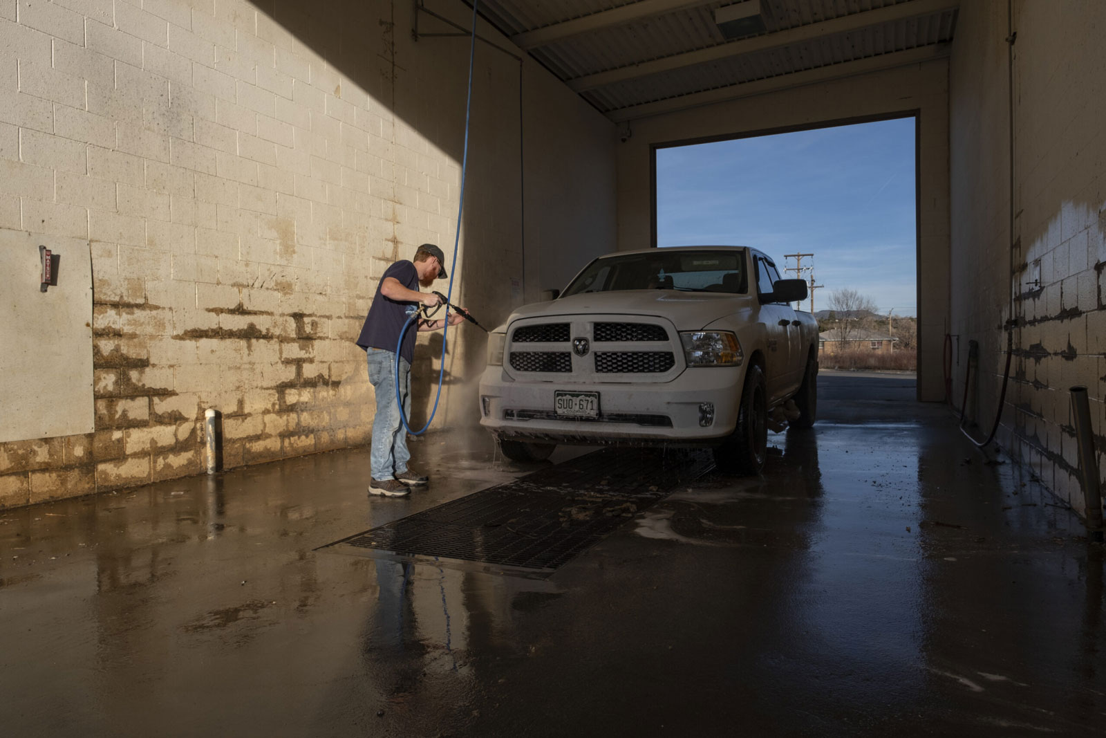 Chris McCort of Ignacio, Colorado scrubs down his Dodge truck
