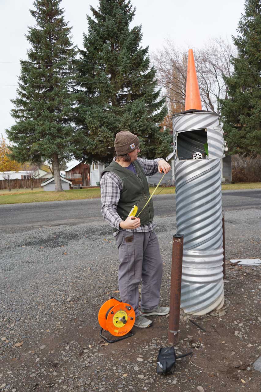 Michael Thoma, a hydrogeologist for the Oregon Water Resources Department, measures water levels in Bonanza, Oregon.