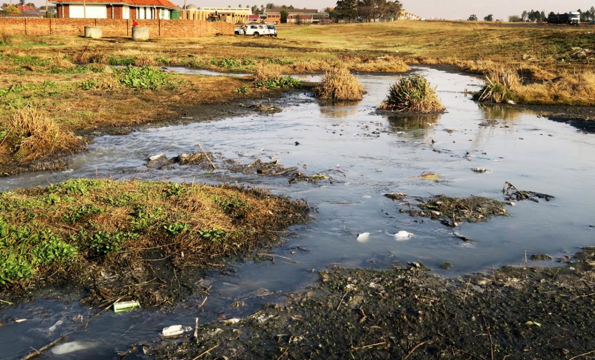 A stream of untreated sewage flowing from a broken pump station in Evander, Mpumalanga